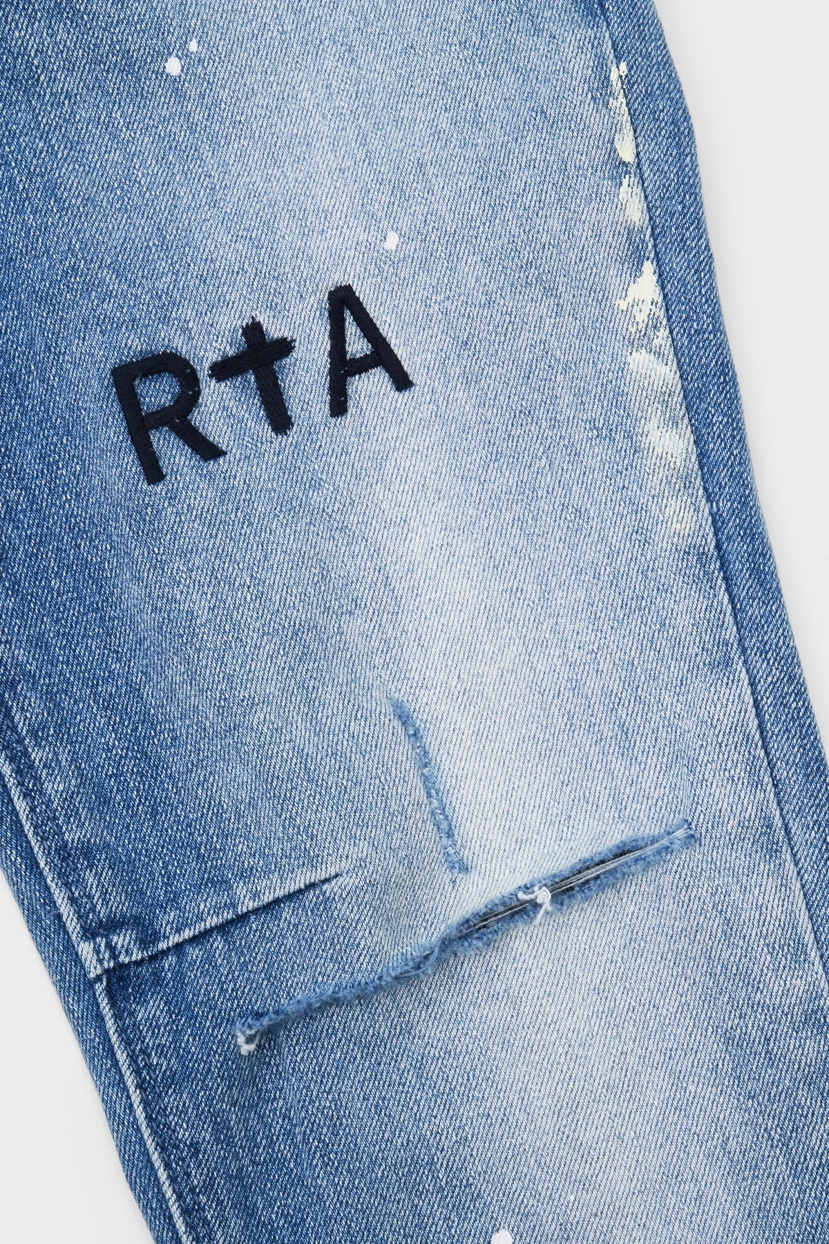 CLAYTON SKINNY JEAN | DISTRESSED WHITE PAINT SPLATTER