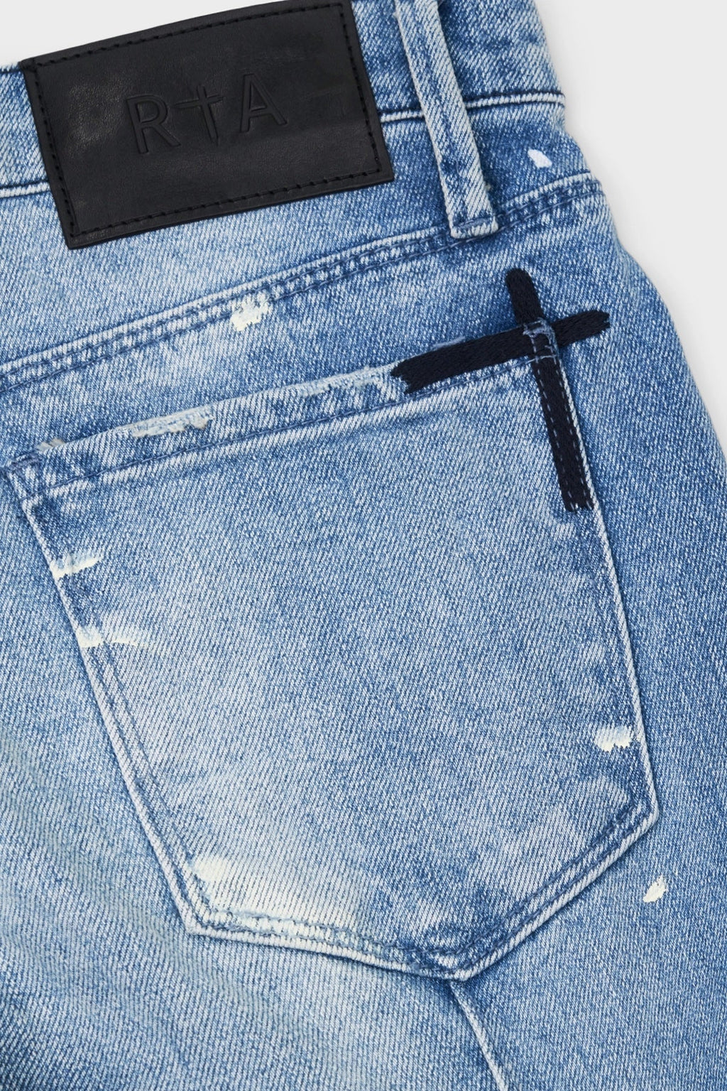 CLAYTON SKINNY JEAN | DISTRESSED WHITE PAINT SPLATTER