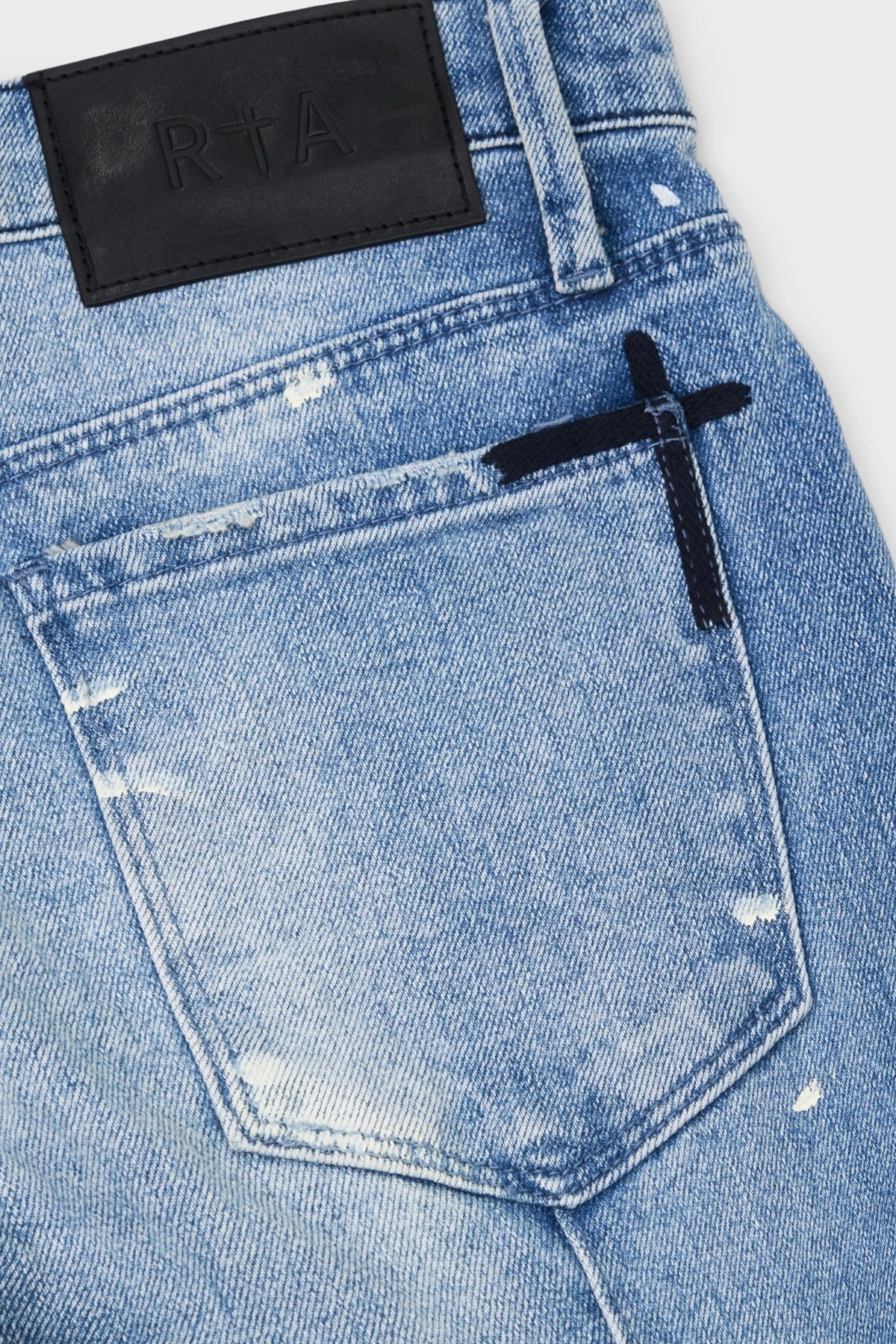 CLAYTON SKINNY JEAN | DISTRESSED WHITE PAINT SPLATTER