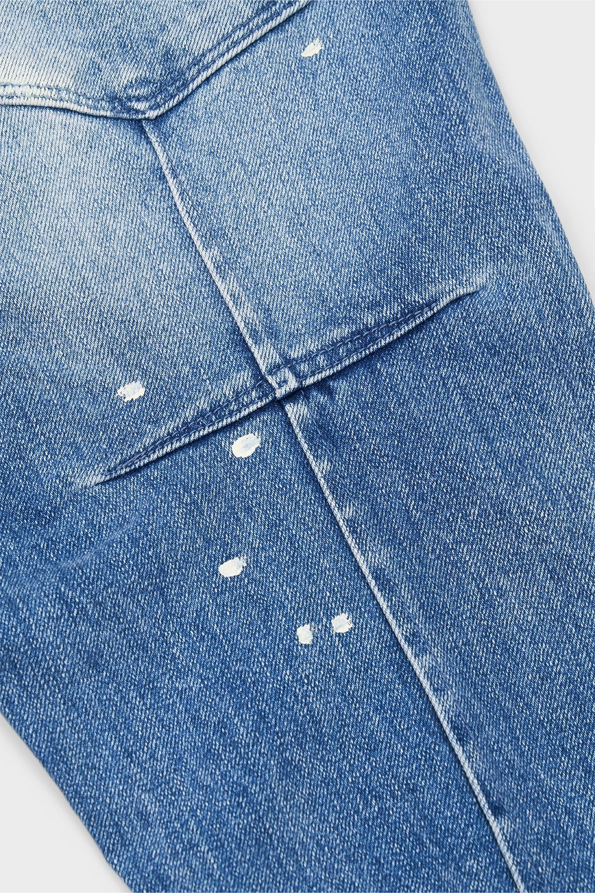CLAYTON SKINNY JEAN | DISTRESSED WHITE PAINT SPLATTER